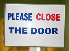 please close the door sign